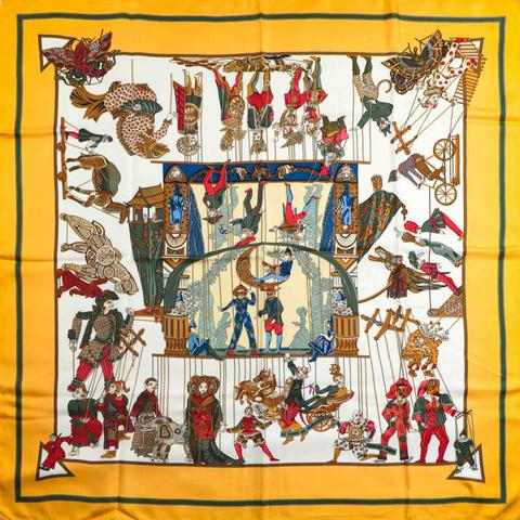 A variation of the Hermès scarf `Le temps des marionnettes ` first edited in 1996 by `Annie Faivre`